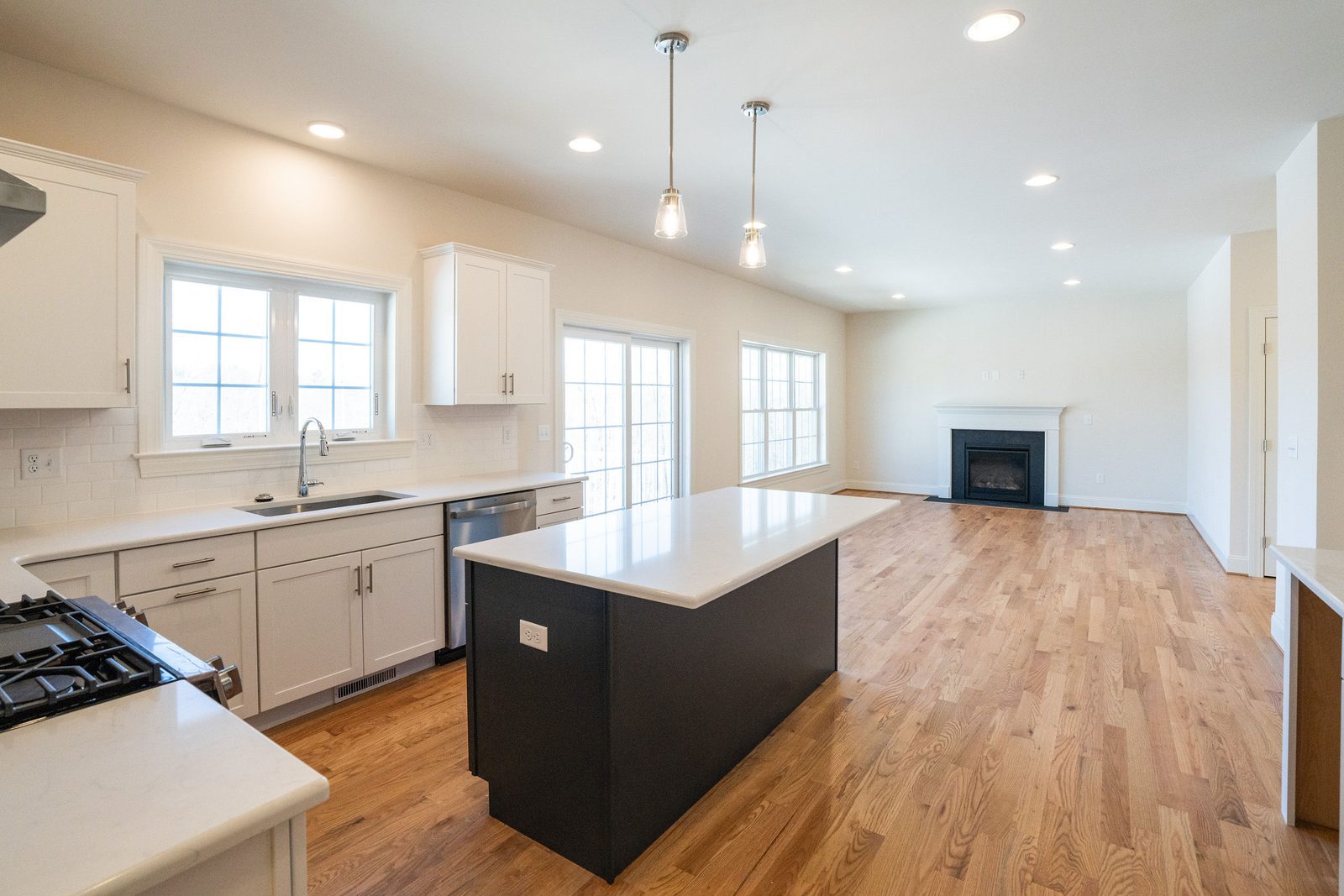 The Groton: kitchen island looking toward the family room