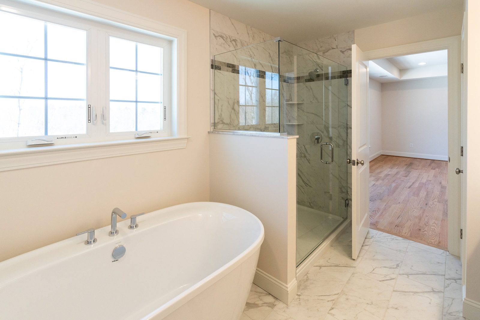 The Groton: primary bath with soaking tub and shower